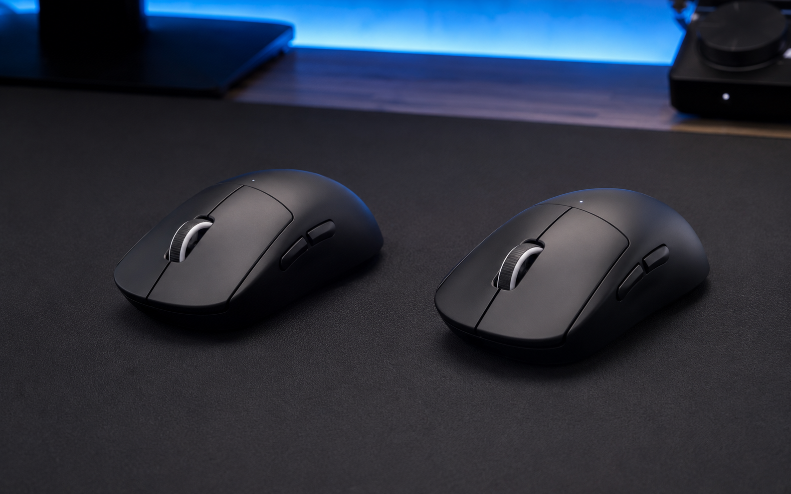 Two black ultra-light wireless gaming mice compared side by side